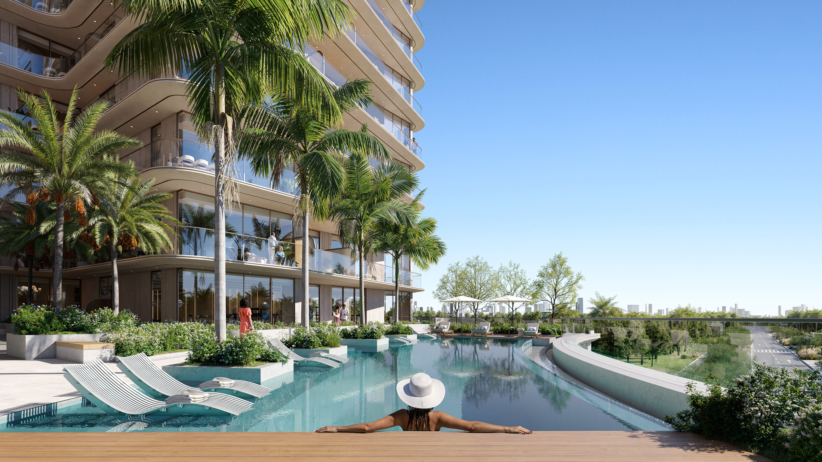 Piscina de borde infinito con reposeras, palmeras y vistas abiertas desde el podio ajardinado.