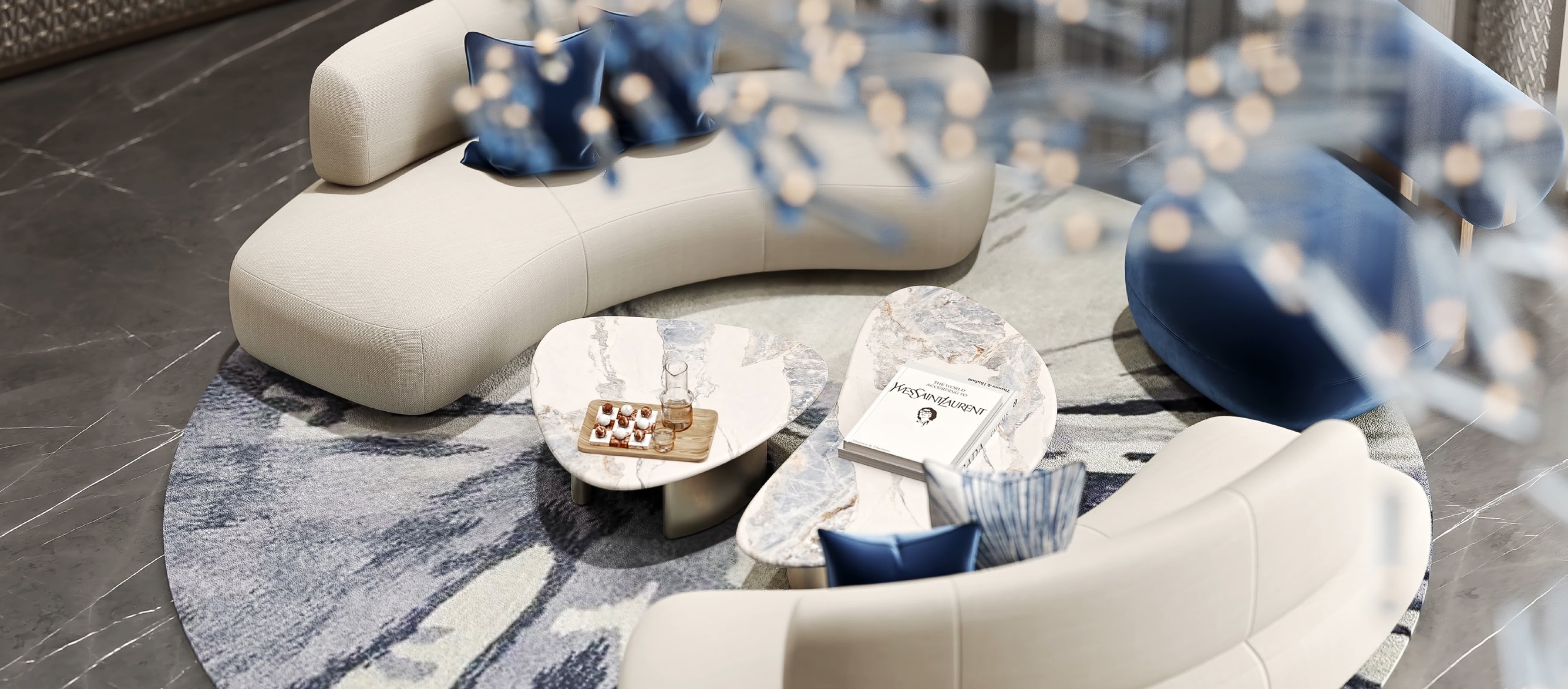 Vista cenital del lounge del lobby con asientos curvos, mesas de mármol y detalles en azul.