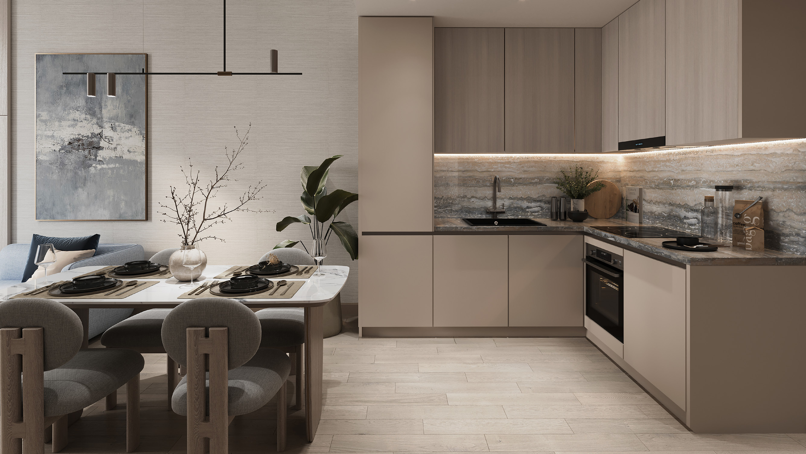 Cocina y comedor integrados con electrodomésticos empotrados, superficies en piedra y terminaciones neutras.