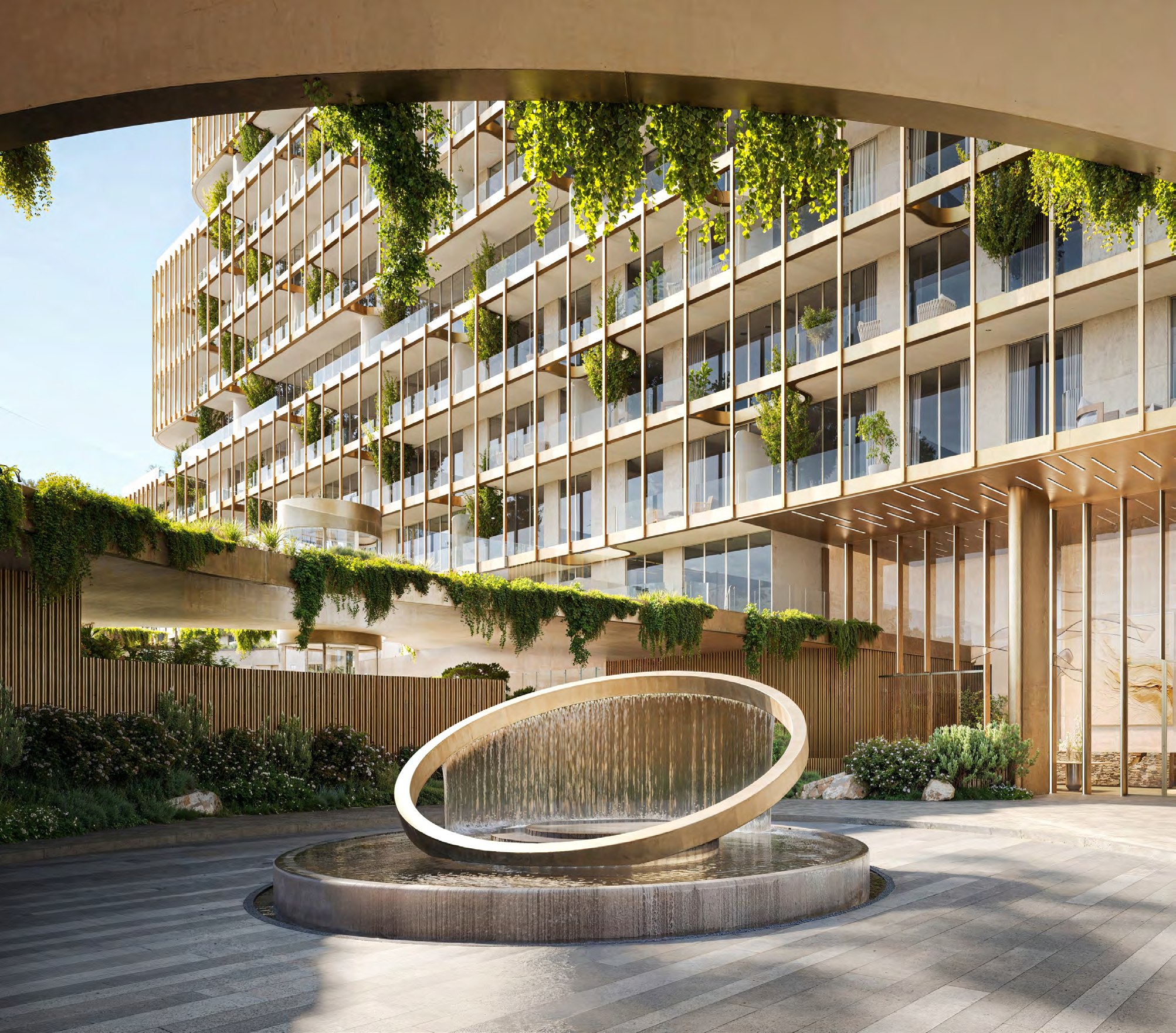 Sculptural circular water feature at HADO's landscaped arrival court.