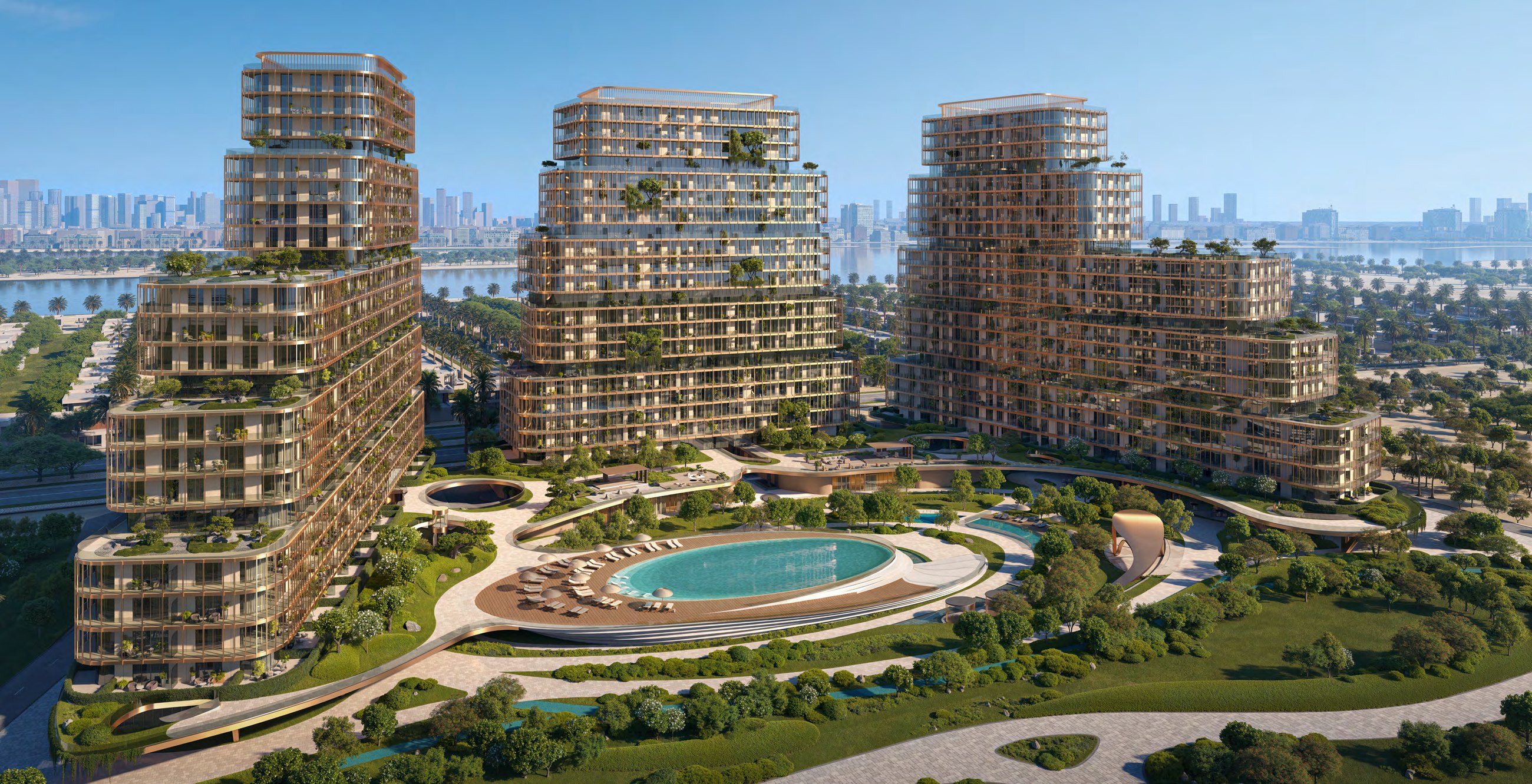 Aerial view of HADO's three terraced residential towers surrounding landscaped gardens and a central pool on Dubai Islands