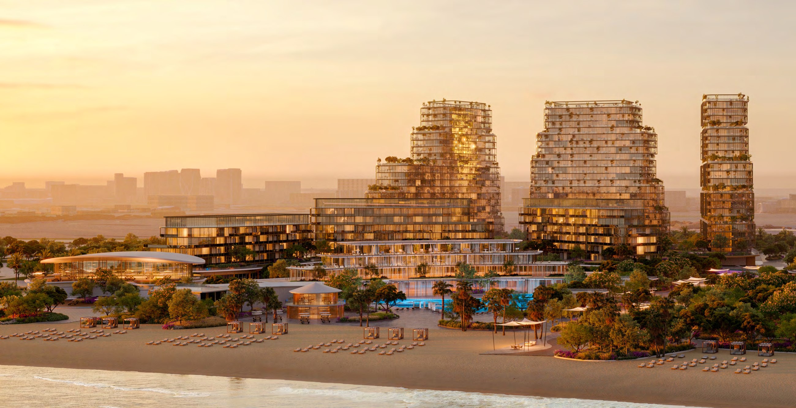 HADO's three towers rising behind a beachfront landscape at sunset within the Siora masterplan.