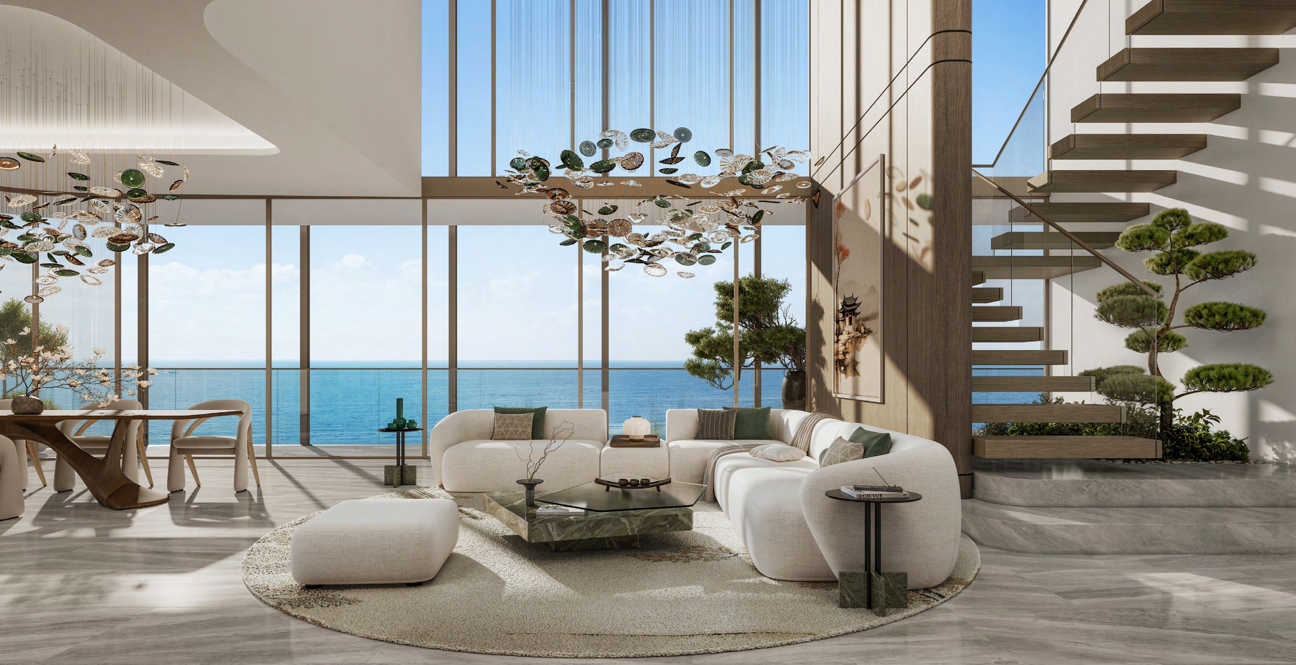 Double-height duplex living room with sculptural staircase and sea view.