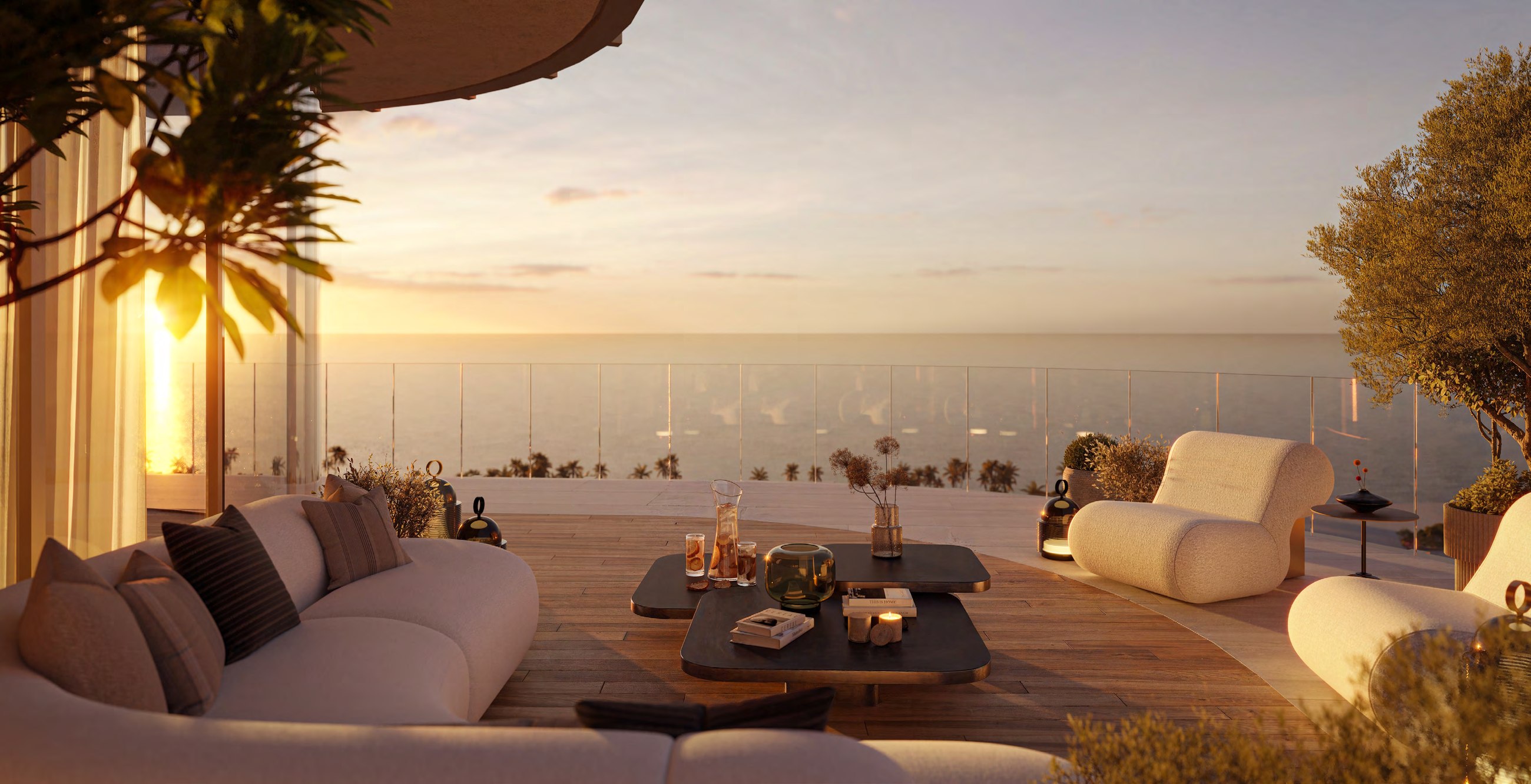 Furnished private terrace overlooking the sea at sunset.