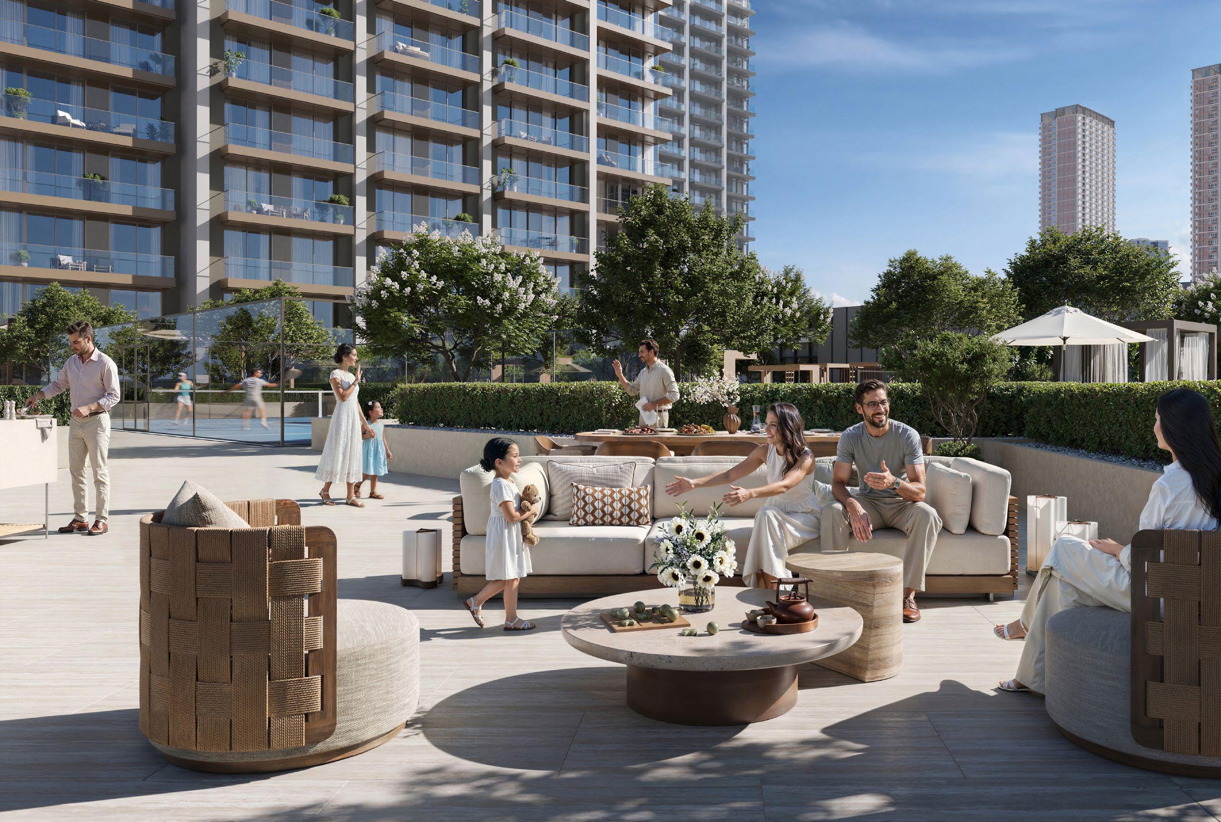 Lounge social ajardinado al aire libre en el podio de amenities de Valia
