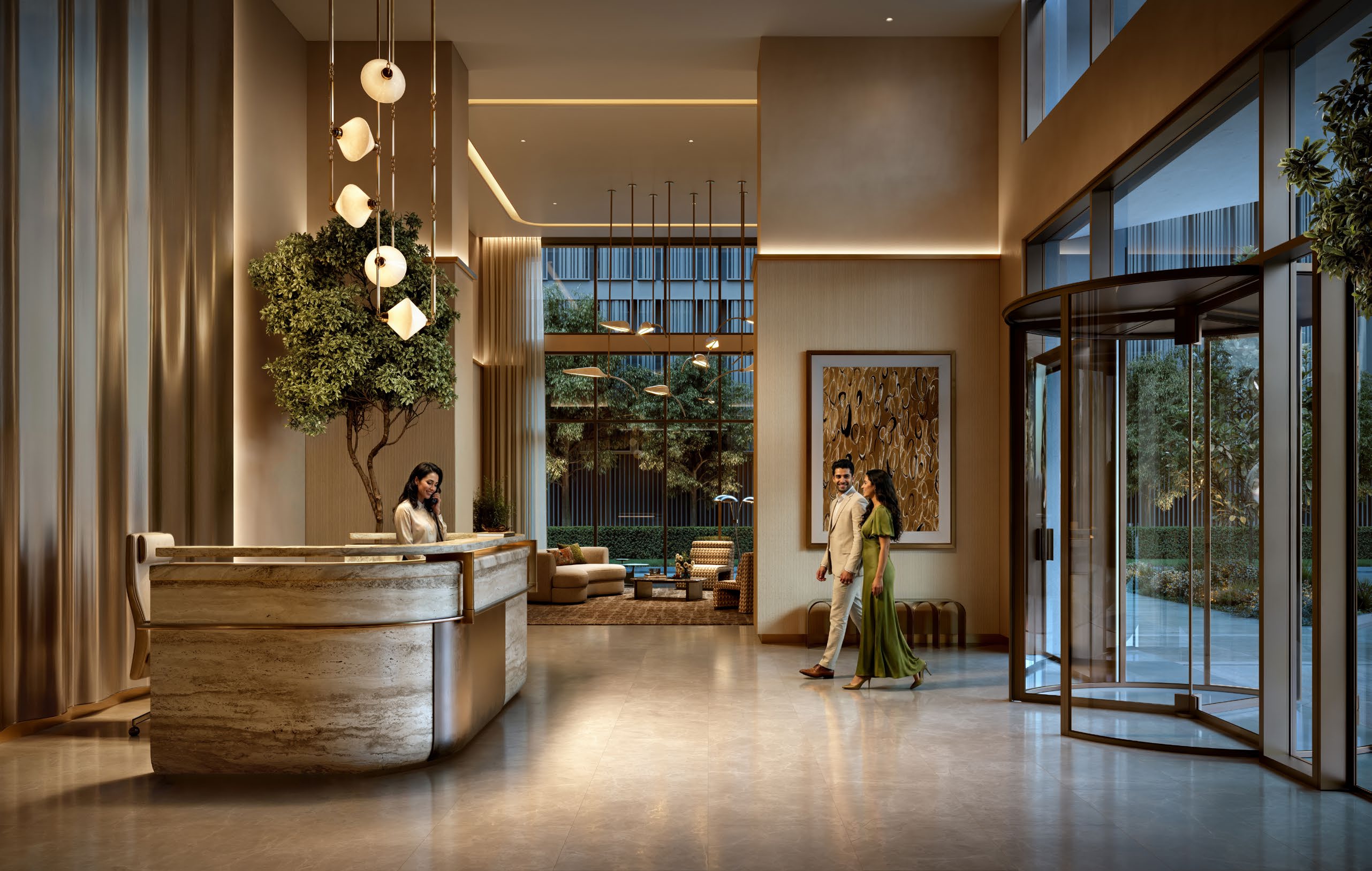Lobby de doble altura y recepción en Valia
